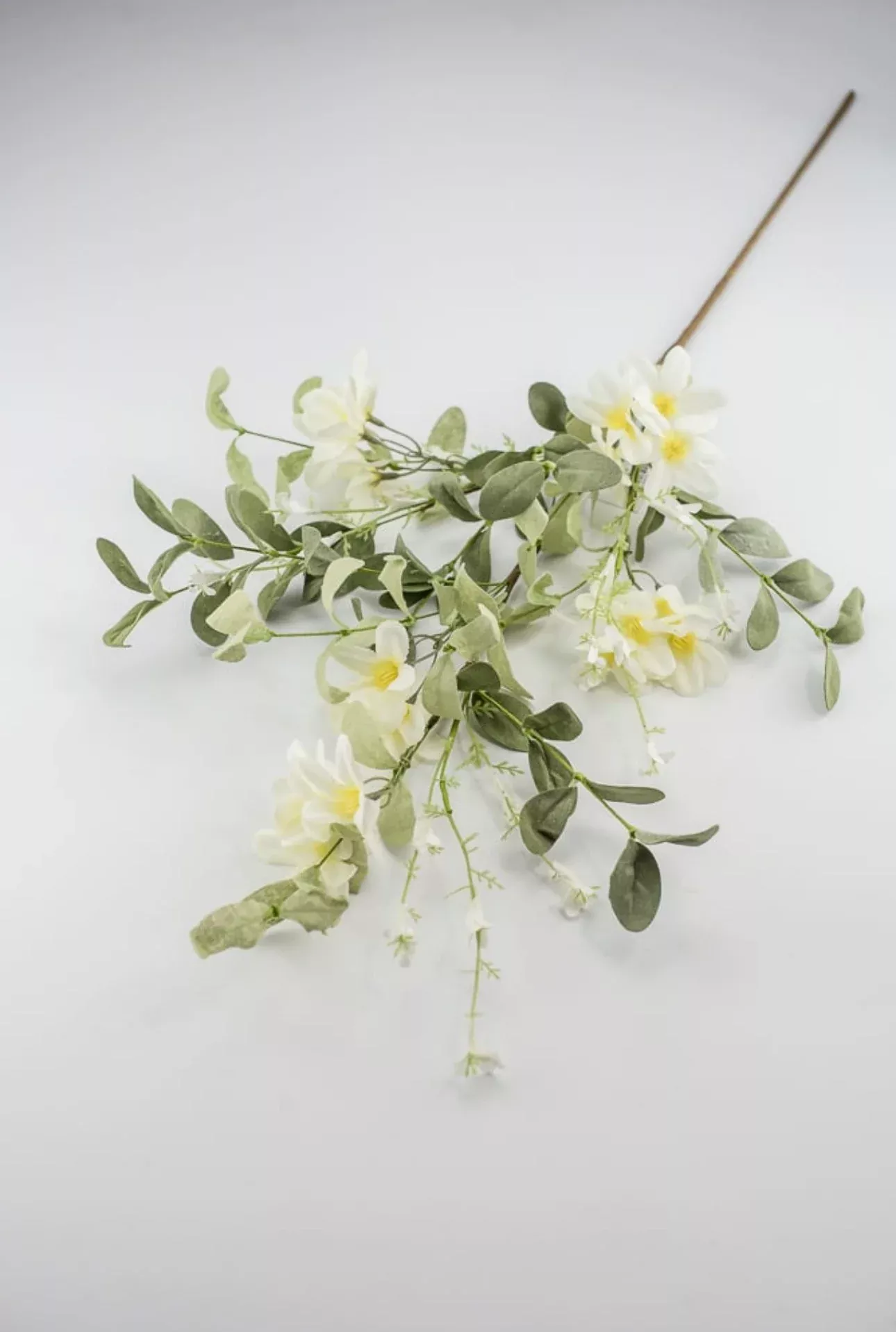 Off white flower and greenery spray